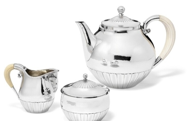 Johan Rohde: Sterling silver tea set with slightly hammered surface and carved ivory handles. (3)