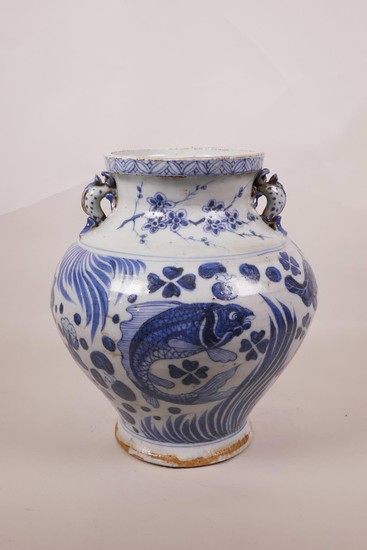 A Chinese blue and white Ming style pottery vase with two dr...