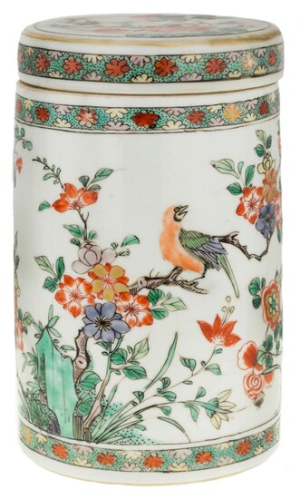 A Chinese famille verte cylindrical jar and cover, Kangxi period, painted to the exterior with peony, rock, and birds perching on flower branches in between two floral bands, the cover similarly decorated, 16.5cm high 清康熙 五彩繪花鳥圖紋蓋罐