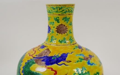 A Chinese yellow ground porcelain fahua vase with dragon...
