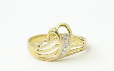 A Continental 14ct gold ring set with white stones. Ring siz...