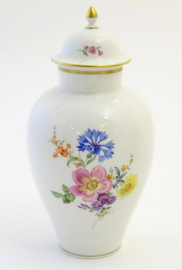 A Continental lidded vase with hand painted floral