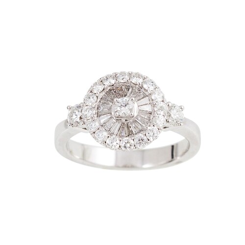 A DIAMOND CLUSTER RING, set with brilliant and baguette cut ...