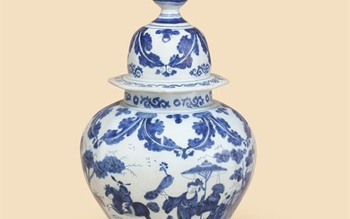 A DUTCH DELFT BLUE AND WHITE OCTAGONAL SECTION BALUSTER VASE AND COVER, CIRCA 1700