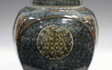 A David Frith studio pottery jar and cover of high-shouldered form, the mottled blue ground decorate