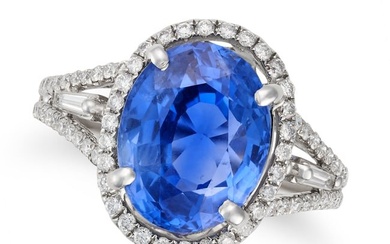 A FINE 7.12 CARAT CEYLON NO HEAT SAPPHIRE AND DIAMOND RING set with an oval cut sapphire of 7.12