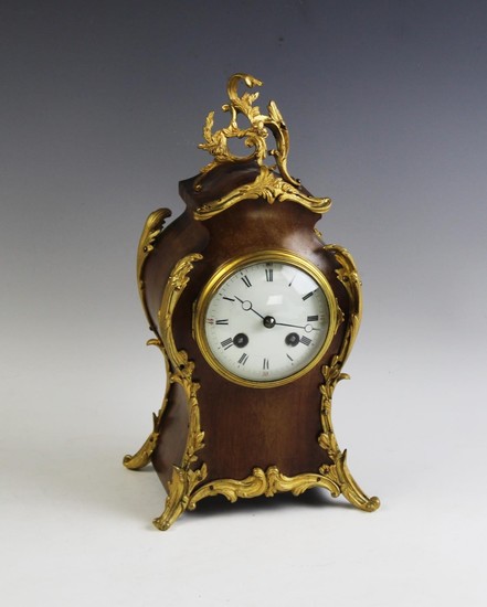 A French walnut and ormolu mantel clock, late 19th century, ...