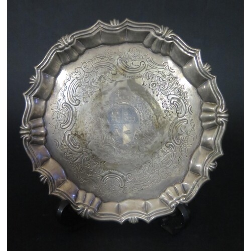 A George II Silver Pie Crust Salver with chased foliate scro...