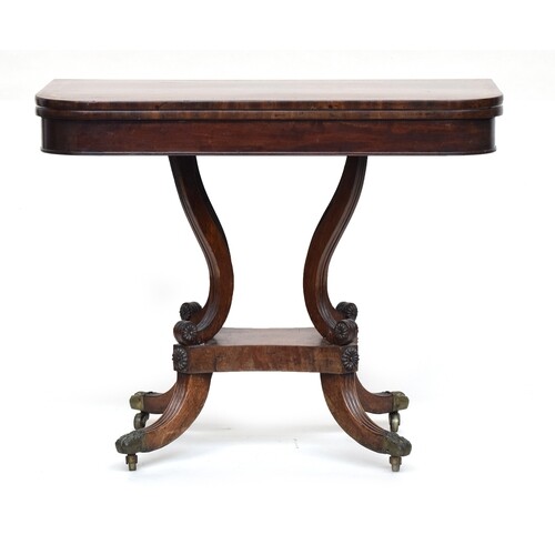 A Georgian mahogany card table, swivel top, with brass acant...
