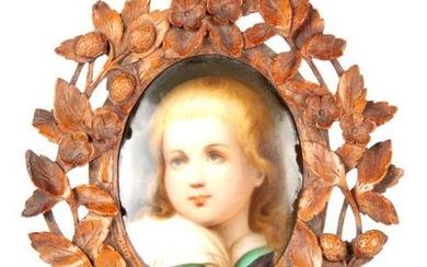 A LATE 19TH CENTURY GERMAN PORCELAIN PLAQUE IN CARVED BLACK...