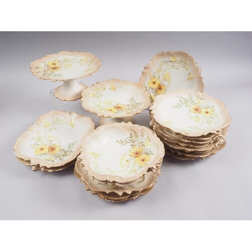 A Limoges yellow poppy decorated dessert service for twelve,...