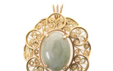 A MODERN OVAL BROOCH OR PENDANT SET WITH JADE, PROBABLY PAKISTANI.