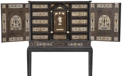 A Milanese cabinet, bone inlaid ebonized wood. Late 19th century. Later stand....