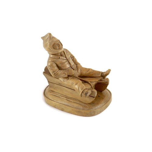 A North European novelty carved beech inkwell in the form of...
