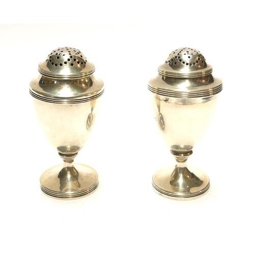 A PAIR OF GEORGIAN SILVER BALUSTER PEPPERETTES With pierced ...