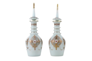 A PAIR OF OPALINE GLASS DECANTERS FOR THE OTTOMAN