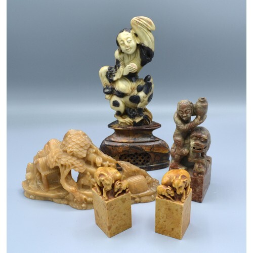 A Pair of Chinese Soapstone Models of Goats with square base...