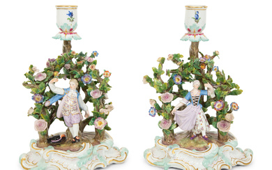 A Pair of Meissen Porcelain Figural Candlesticks with Floral Arbors