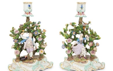 A Pair of Meissen Porcelain Figural Candlesticks with Floral Arbors
