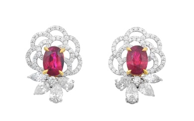 A Pair of Ruby and Diamond Cluster Earrings the oval...