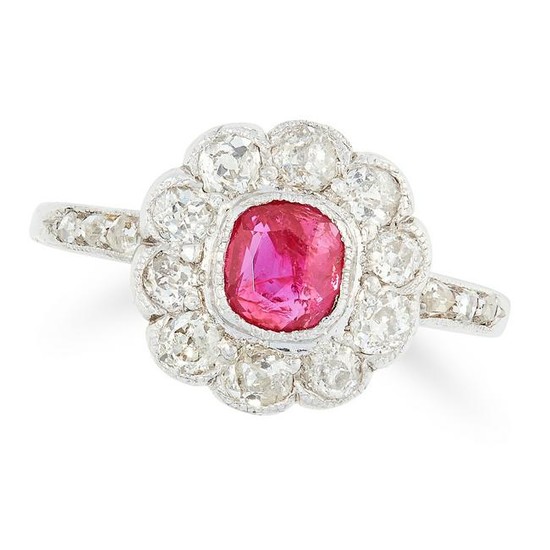 A RUBY AND DIAMOND CLUSTER RING set with a cushion cut