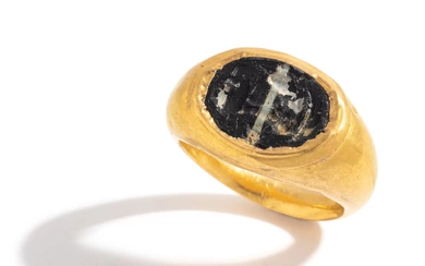 A Roman Gold and Banded Glass Finger Ring with a Kneeling Hero