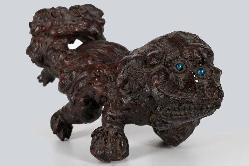 A Rootwood Lion Form Paperweight, Qing Dynasty.
