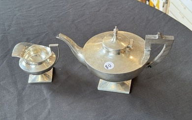 A STERLING SILVER TEAPOT AND CREAMER