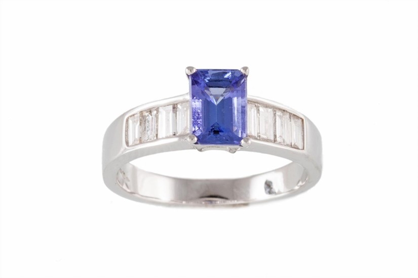 A TANZANITE AND DIAMOND RING, with emerald cut tanzanite of ...