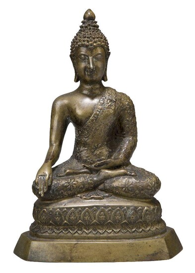 A Thai bronze figure of Shakyamuni Buddha, 19th century, cast in dhyanasana on a base decorated with lotus leaves, his right hand in bhumisparshamudra, his left hand in varadamudra, 22cm high