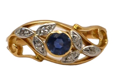 A VINTAGE YELLOW METAL, BLUE TOPAZ AND DIAMOND FLORAL...