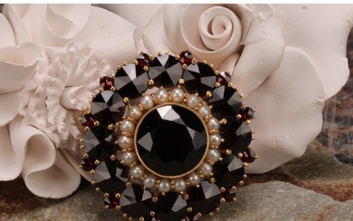 A Victorian style garnet and seed pearl target brooch, the l...