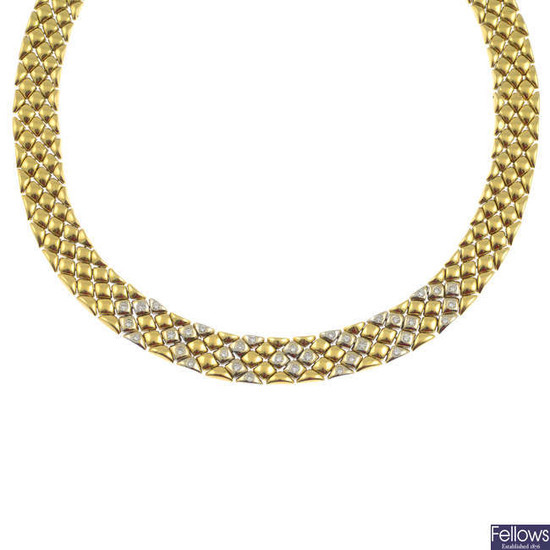 A brilliant-cut diamond bi-colour collar necklace.