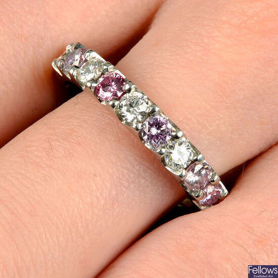 A brilliant-cut 'pink' diamond and diamond full eternity ring.