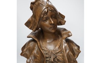 A bronzed terracotta bust of an early 20th century Dutch gir...