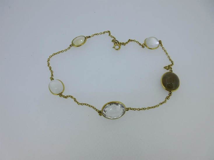 A chain necklace set with five hardstone accents