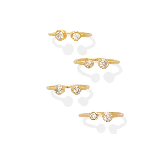 A group of four bezel-set diamond rings