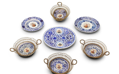 A group of porcelain dishes bearing the image of Nasr...