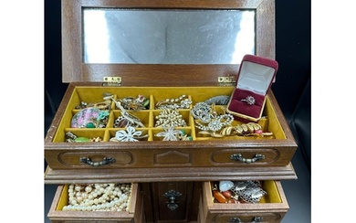 A jewellery box with a selection of quality costume jeweller...