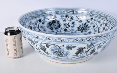 A large Chinese porcelain blue and white bowl decorated with foliage 15 x 40 cm.