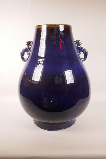 A large Chinese purple flambé glazed pottery vase with two d...