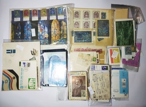 A large collection of stamps , envelops , postcards