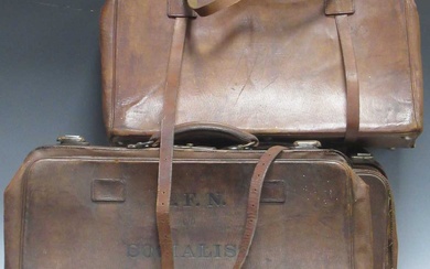 A late 19th century leather expanding valise with canvas lined divided interior, stamped and