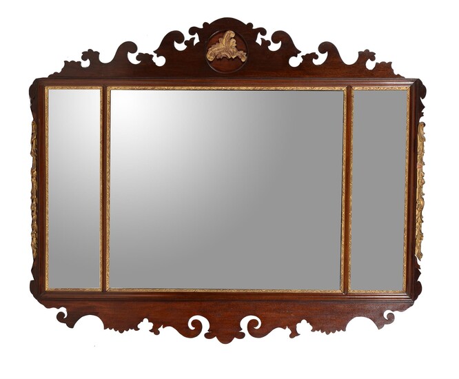 A mahogany and parcel gilt fretwork wall mirror in George II style