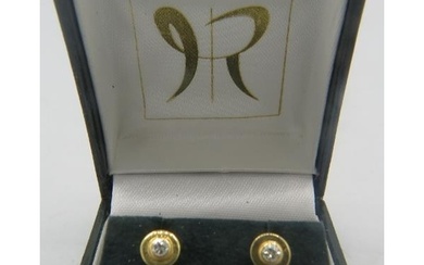 A pair of 14ct yellow gold and diamond stud earrings, marked...