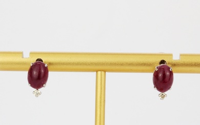 A pair of 18ct white gold stud earrings set with cabochon rubies and diamonds, L. 1cm.