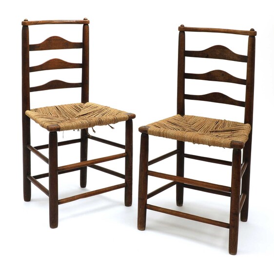 A pair of Arts and Crafts oak chairs