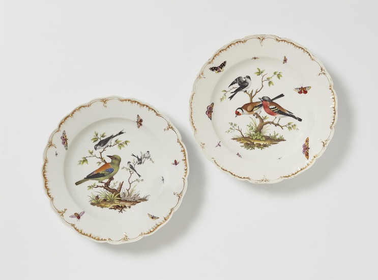 A pair of Berlin KPM porcelain plates from a dinner service with bird motifs
