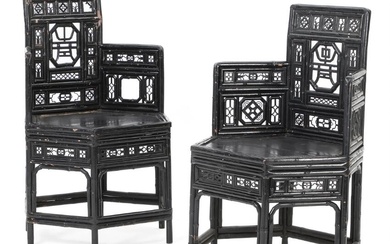 A pair of Chinese black lacquer bamboo barrel shape armschairs. C. 1900....
