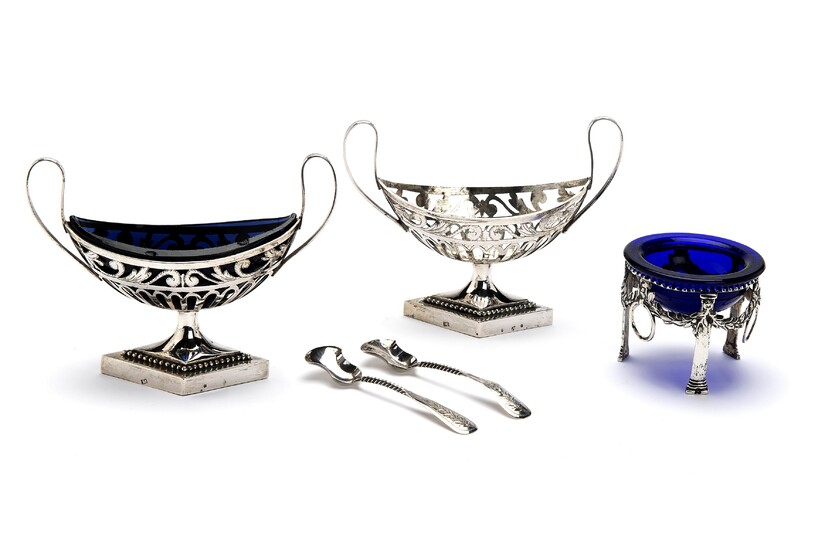 A pair of Dutch silver salt cellars with one glass liner and two spoons